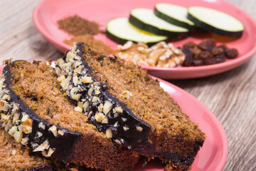 Pieces of zucchini dough with nuts and raisins. Delicious dessert