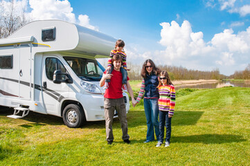 Family vacation, RV travel with kids, happy parents with children have fun on holiday trip in...