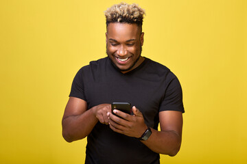 A cheerful correspondence is conducted by a young black guy in a chat with his friends. Stylish...