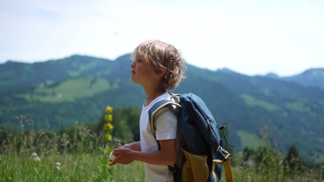 One thoughtful child walking outdoors in nature kid hiking outside