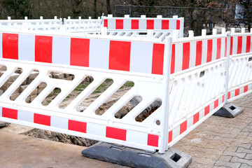 white construction equipment for city, ground in a trench on the street, repairing a road,...