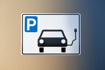 Electric car parking sign with charging information. On gold blue background.