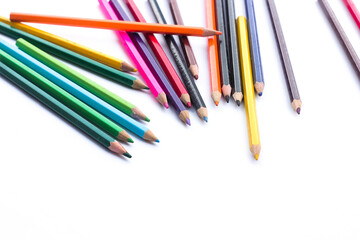 Colored pencils background. Color pencils on white background.