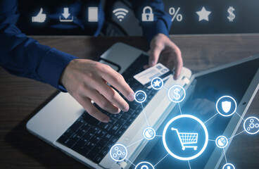 Male hand touching in shopping cart. E-commerce. Online shopping