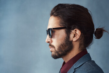 When youre just that cool. Studio shot of a handsome and dapper young man posing against a grey background.