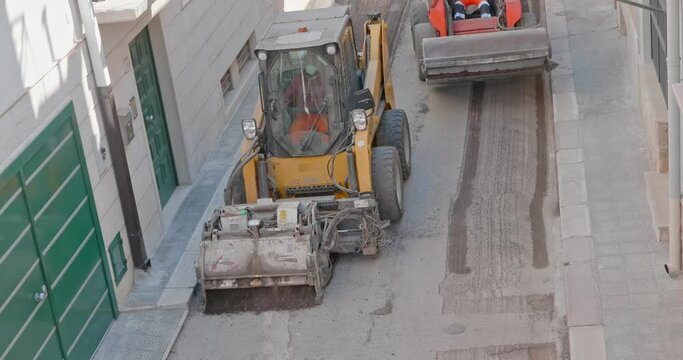 Milling of asphalt for road reconstruction accessory for skid steer