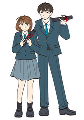 卒業証書を手に持って立っている女子学生と男子学生