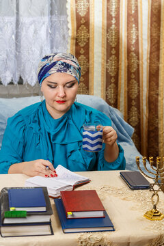 A Female Rabbi Of The Kisui Rosh Reform Judaism Congregation Draws Up An Activity Plan And Drinks Coffee.