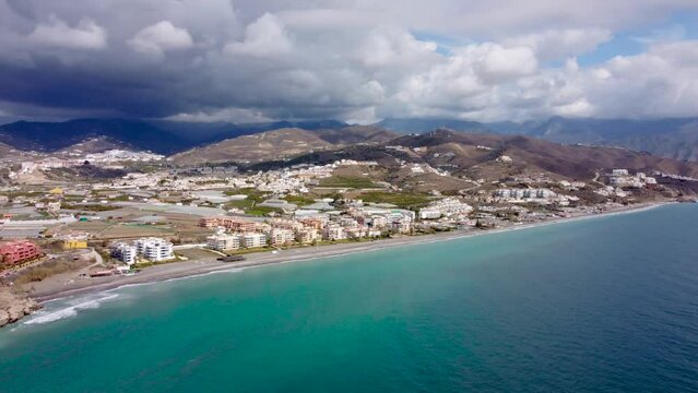 Torrox Costa view from above. Drone footage of this costal city situated in Malaga province, Costa del Sol - Spain. Touristic travel destination. Left panning 