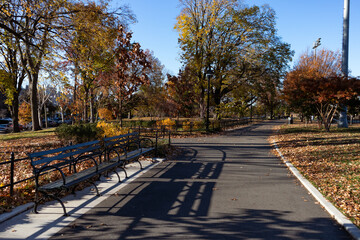 Empty Path at Astoria Park with Colorful Trees and Benches during Autumn in Astoria Queens New York