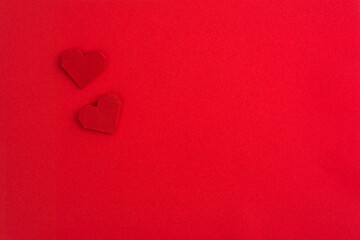 Obraz premium Red origami hearts on red background