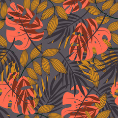 Fototapeta na wymiar Fashionable seamless tropical pattern with bright plants and leaves on a gray background. Modern abstract design for fabric, paper, interior decor. Tropical botanical. Hawaiian style.