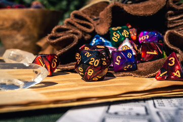 close-up of RPG dice spilling out of a dice bag