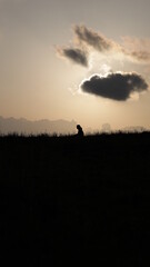 Fototapeta na wymiar silhouette of a person on a sunset
