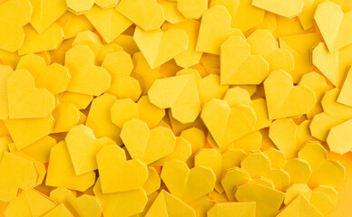 A group of yellow origami hearts background - obrazy, fototapety, plakaty