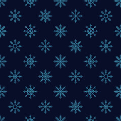 Navy seamless pattern with blue snowflakes.