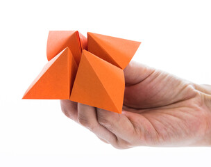 People hand holding a origami fortune on white background