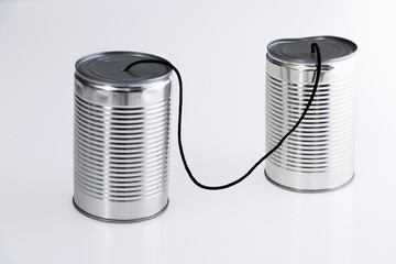 Tin cans telephone on white background