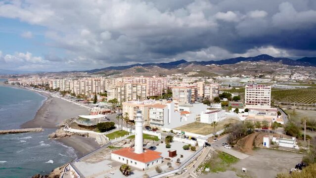 Torrox Costa view from above. Drone footage of this costal city situated in Malaga province, Costa del Sol - Spain. Touristic travel destination. Drone rotating and panning right
