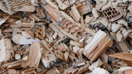 Pile of construction waste after wall demolition in an apartment during remodeling