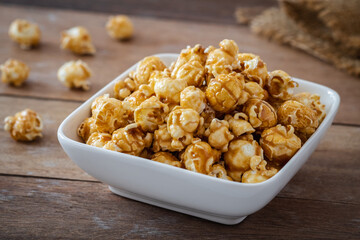Popcorn with caramel in white bowl