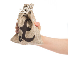 Hand holding a money bag with pound sign