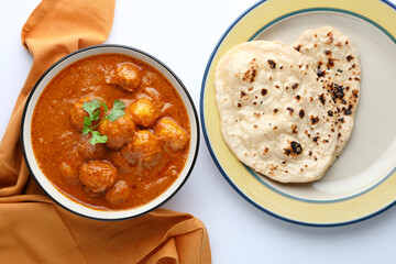Dum aloo or potato curry with butter nan, tandoori roti