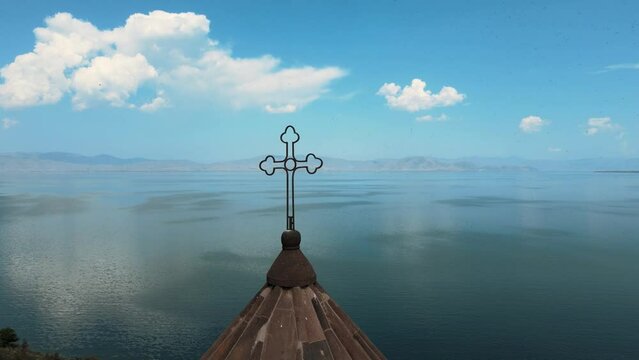 HAYRAVANK Church in Armenia, on the shore of Lake Sevan, flying around the cross