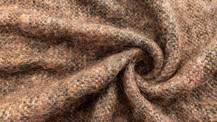 Twisted brown lambswool fabric with waves and curves. Wool material. felt texture