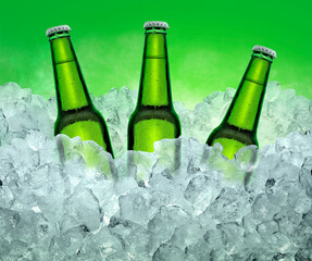 Three beer bottles getting cool in ice cubes. on the White color smoke background