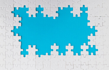 Pieces of jigsaw puzzle on blue background