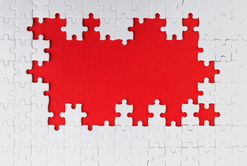 Pieces of jigsaw puzzle on red background