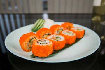 Japanese roll with tuna and white rice in tobiko caviar