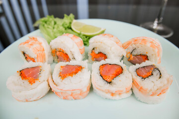 a Japanese roll with shrimp and salmon with white rice