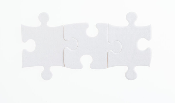 Three Puzzle Pieces On White Background