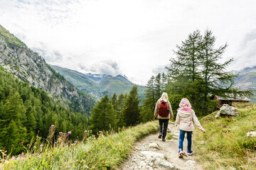 Fototapeta na wymiar happy family hiking in scenic mountains