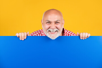 happy senior man with copy space on blank banner. advert