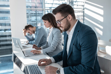 Group of business people is sitting in the conference room and preparing  for business strategy speech.	