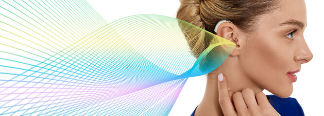 Woman with hearing aid behind the ear with colorful sound waves showing variety of sounds going to...