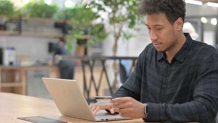 African American Man Shopping Online on Laptop