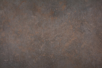 Rusty metal background. The texture of the brown bronze background is covered with a patina. 