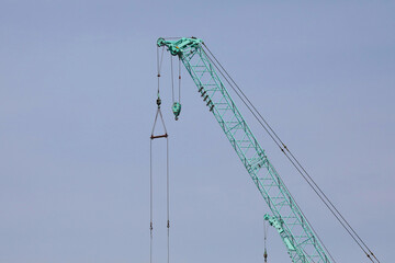 Work site crane towering in the sky