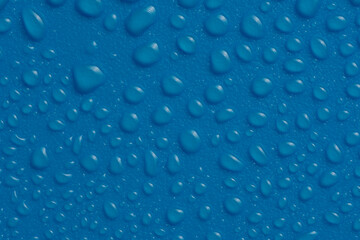 Water Drops On the blue Background. Abstract orange wet texture with bubbles on plastic PVC surface or grunge.