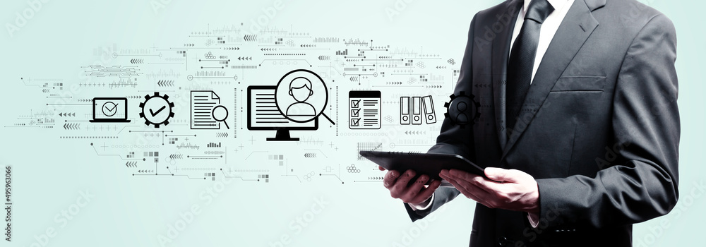Poster document management system concept with businessman holding a tablet computer