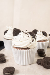 Chocolate cupcakes with cream and  Oreo cookies