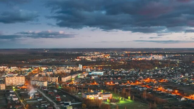 Dobrush, Gomel Region, Belarus. Aerial View Of Dobrush Cityscape Skyline In Autumn Evening. Residential District During Sunset. Bird's-eye View. Day To Night Time Lapse Hyperlapse