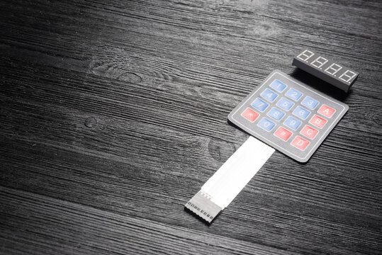 Door access control keypad on the black background with copy space.