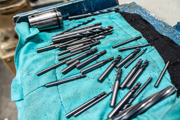 equipment, tools, pieces of machinery Various types are placed together on a blue cloth. to change.