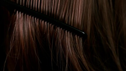Super slow motion of brushing beautiful healthy long smooth brown hair. Filmed on high speed cinematic camera at 1000 fps. - Powered by Adobe
