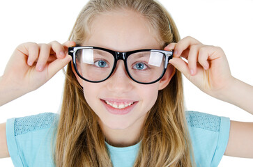 Closeup portrait of a preteen girl in big glasses, studio shot, isolated on white background